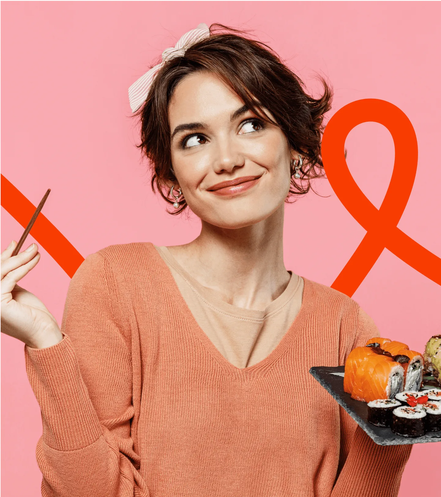 Young woman holding sushi