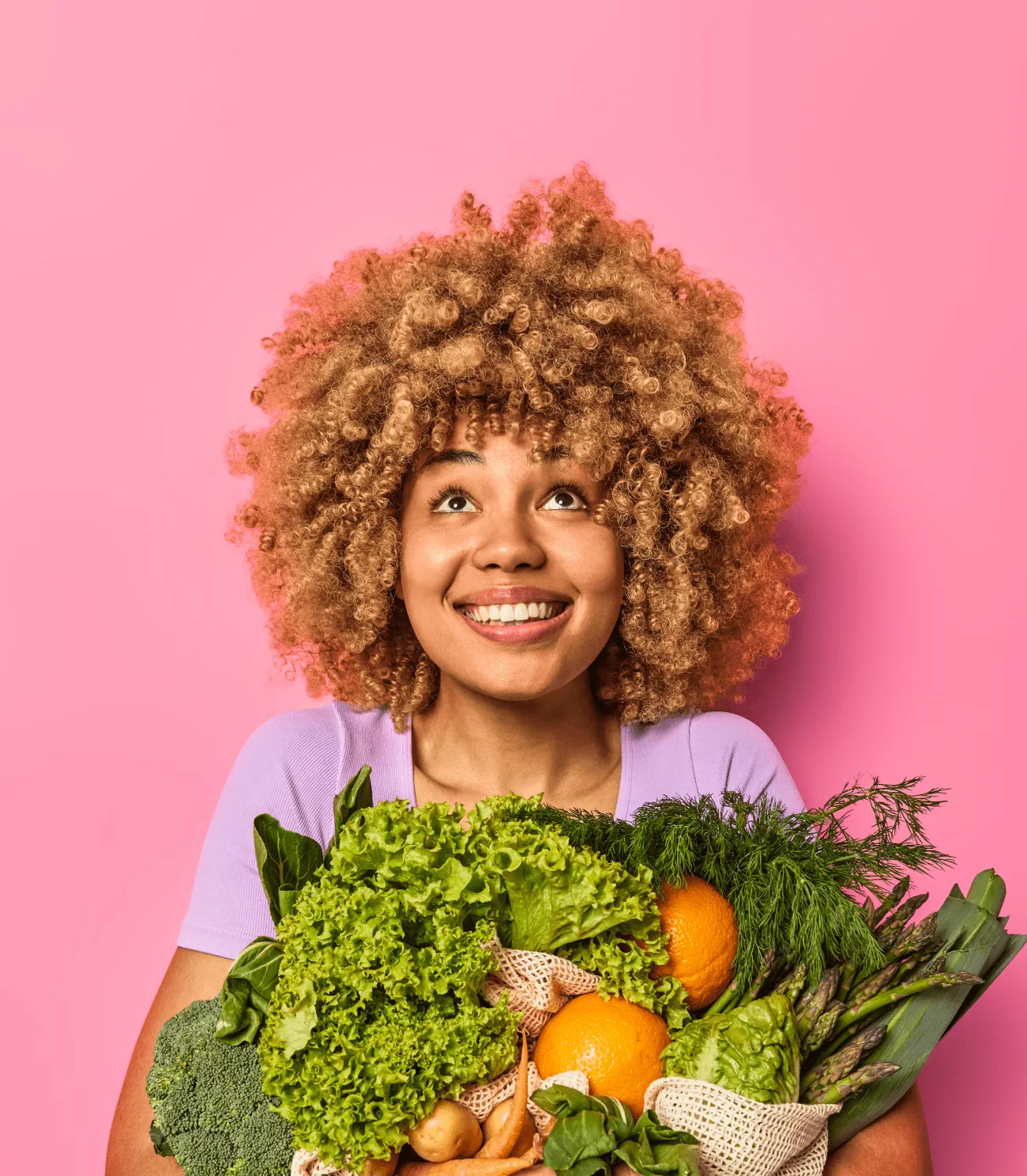 Young afro-american woman holding vegetable